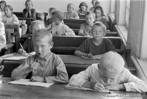 School children during classes in one of the collective farms of the Volga German Autonomous Soviet Socialist Republic, 1932.