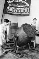 The workers of the Laub collective farm [pictured] during the butter making process at the farm’s dairy, 1933.